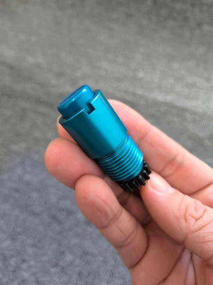 Opposite end of the prosthetic lock core held in a hand