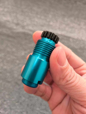 Prosthetic lock core held in a hand for scale