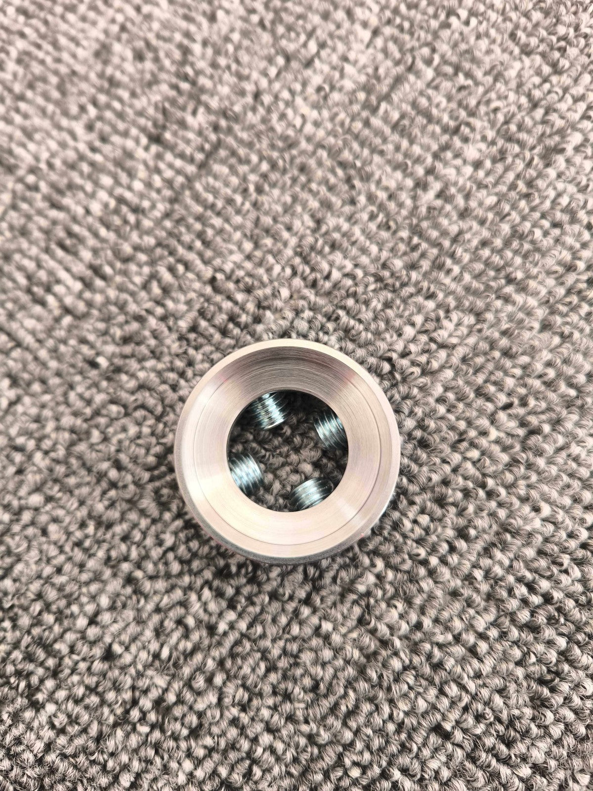 Top view showing the internal threads of the prosthetic socket adapter