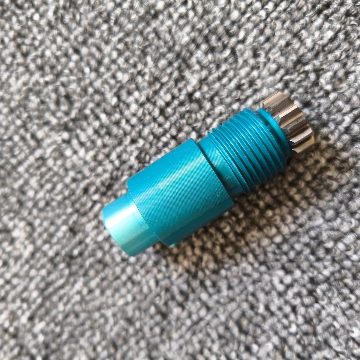 Reverse-thread lock core shown on a fabric surface